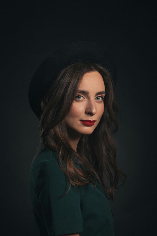 Laura E.